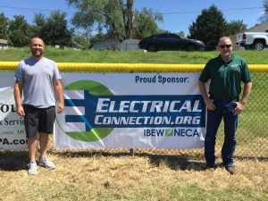 Left to right, Jake Hibbits, IBEW Local 1 journeyman wireman,and IBEW Business Representative Chuck DeMoulin at the Twin City Little League field.