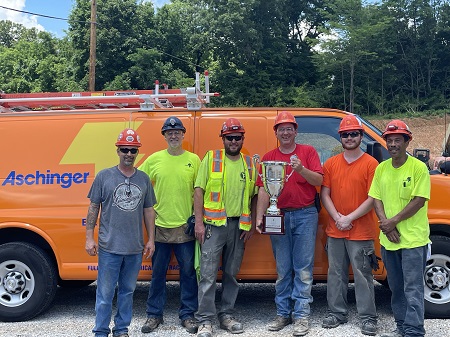 Electricians holding award