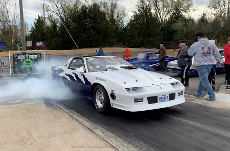 White car at Autos 4 Autism drag races