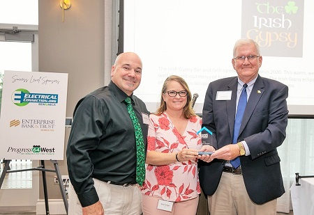 Denny and Amy Corrigan, owners of the Irish Gypsy Bar and Grill accept their award