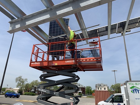 Electrician installing solar panels
