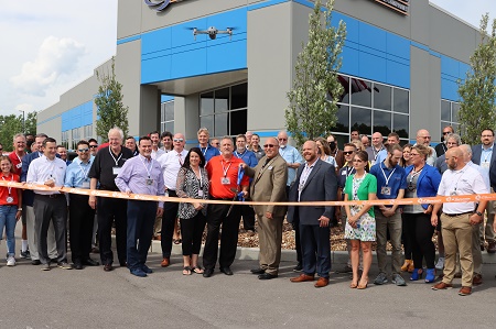 People attending ribbon cutting for TSI Global Companies headquarters 